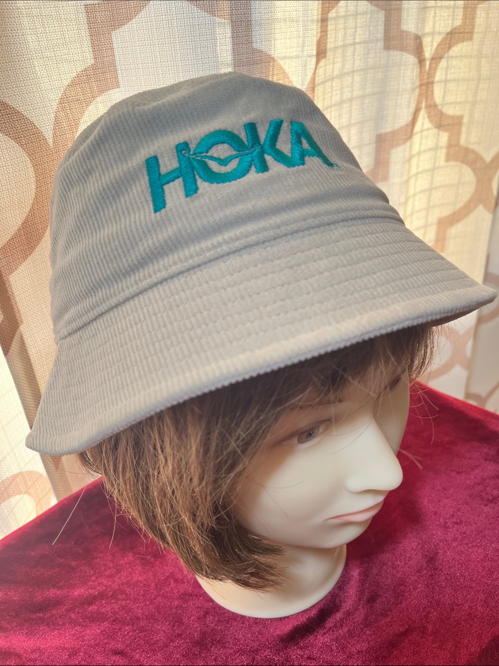 Hoka Summer Mile Club beige Corduroy Bucket Hat with Teal Logo.